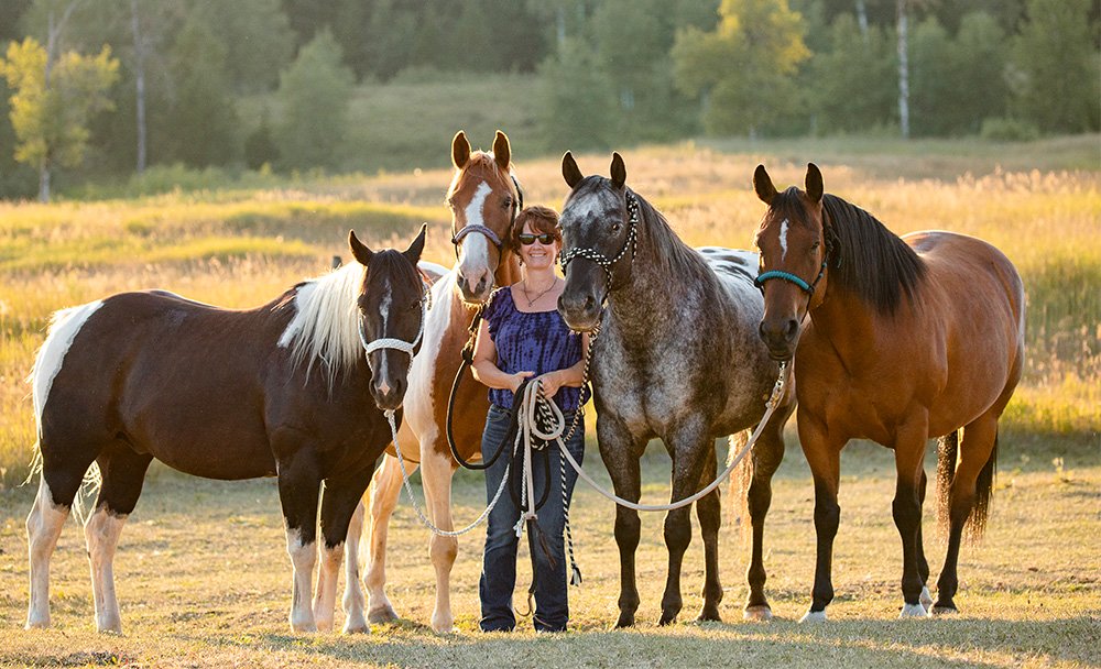 Jenny Edwards with her herd of horses